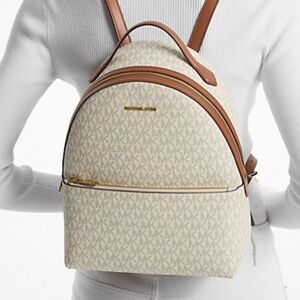 Michael Kors “Sheila Medium Logo Backpack”. In original unopened packaging.